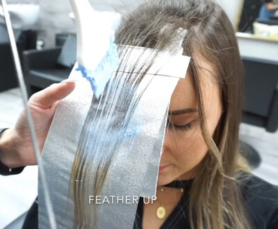 Womens Hair being colored with hair dye