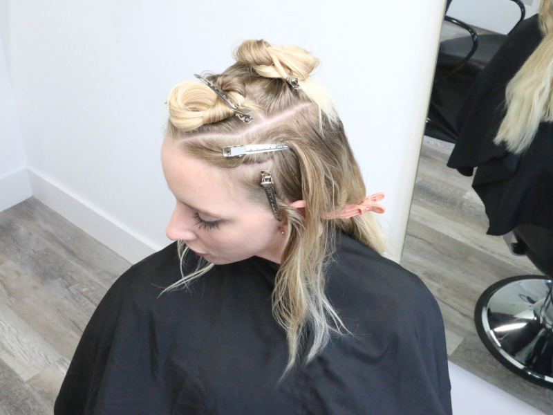 blonde client with hair in pins
