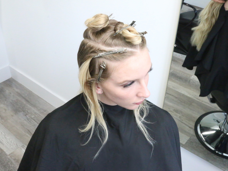 blonde client with hair in pins