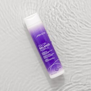 color balance purple shampoo bottle with ripples of water