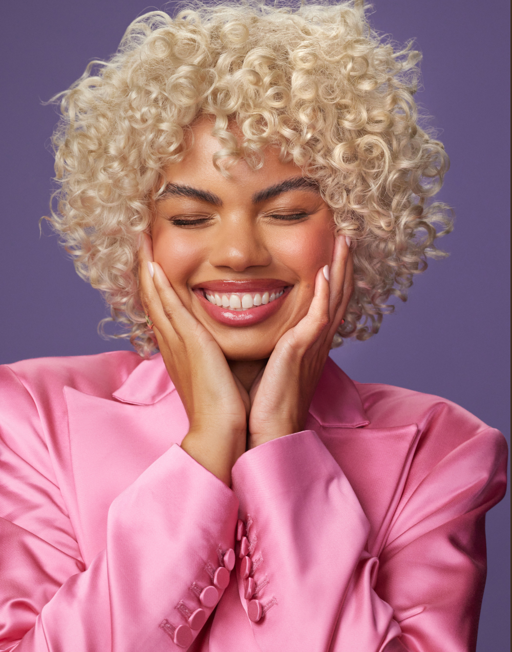curly blonde hair model after treatment